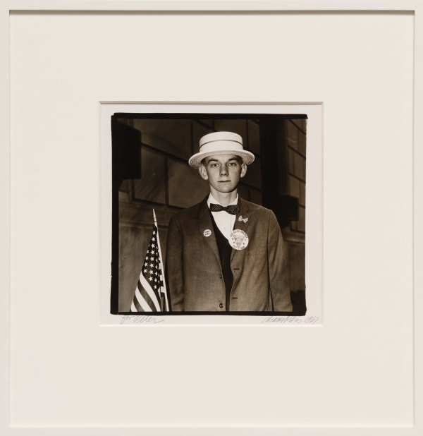 Diane Arbus - Boy with a Straw Hat Waiting to March in a Pro-War Parade, NYC, 1967