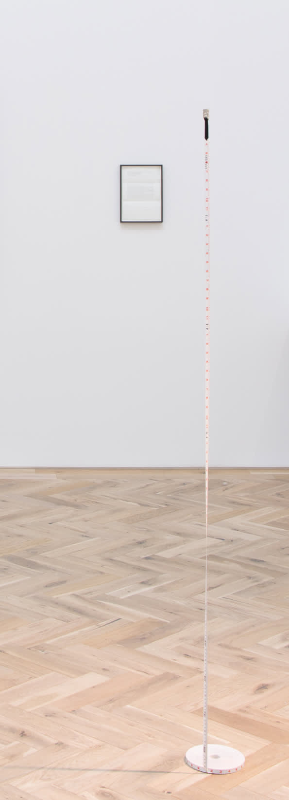 Peter Liversidge From home - how far the moon has, and is, moving away from the Earth since the moon landing, July 20th 1969, 2018 Framed proposal, 1000 year installation plan 1969-2969, 38 meter long measuring tape, monofilament. dimensions as installed