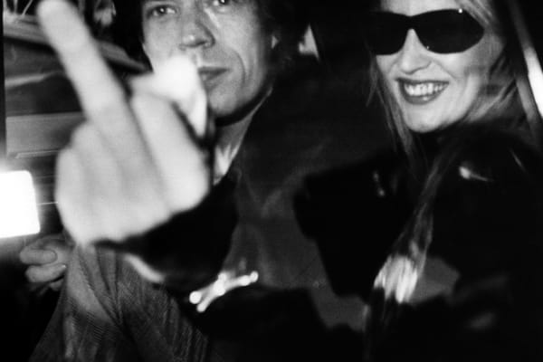 Ron Galella, Mick Jagger and Jerry Hall attending an opening luncheon at Mizuno Gallery, Los Angeles, California, January 16, 1983