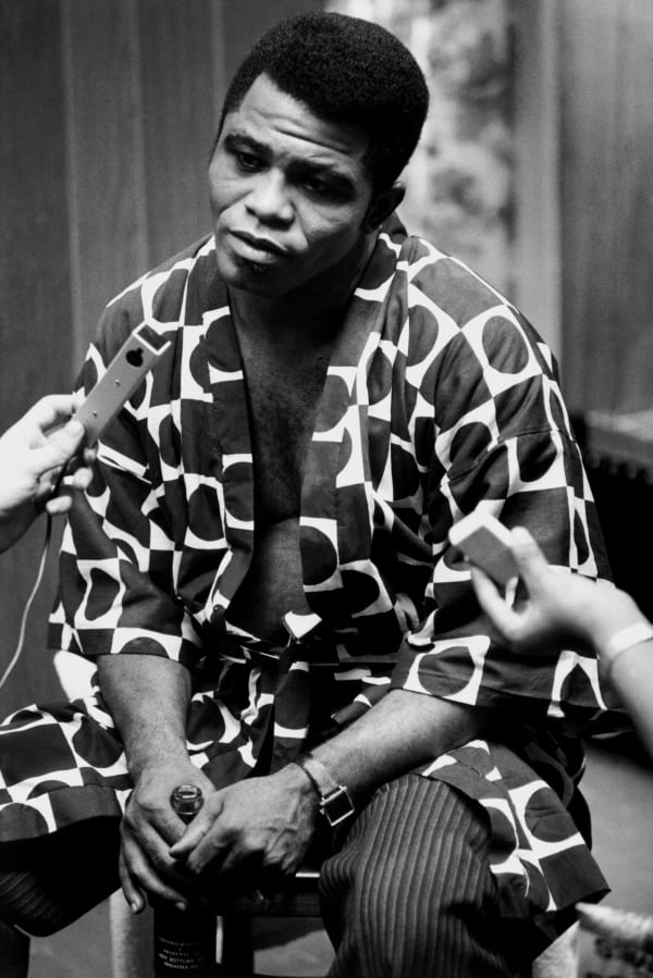 Eve Arnold, American singer and musician James Brown being interviewed after a concert in the Apollo in Harlem where the slogan ‘Black is Beautiful’ was introduced, 1968