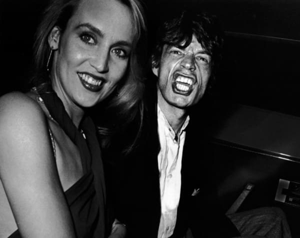 Ron Galella, Jerry Hall and Mick Jagger attend the party for Reid Rogers, Limelight, New York City, 1984