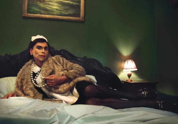 Juvenal Barría Antropología del Servicio, 2018 Digital photography, 12-ink Inkjet print on backlight film, mounted on backlit black acrylic box. Videoperformance, 05 min 50 s, in raspberry monitor. Variable dimensions