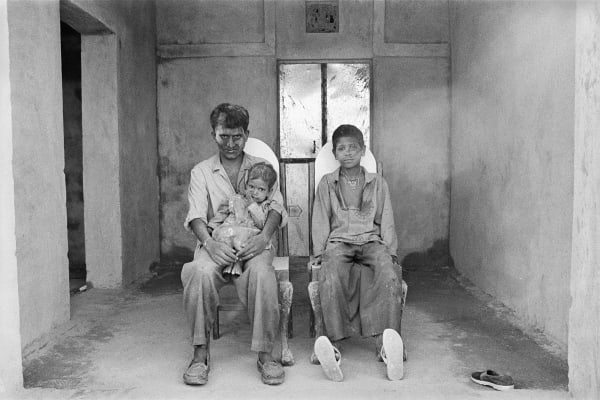 GAURI GILL, Hanuman Nath with his daughter Hina, and Hem Nath, on Holi day, Lunkaransar, from the series Notes from the Desert, 1999-ongoing
