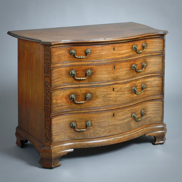 GEORGE III MAHOGANY SERPENTINE COMMODE