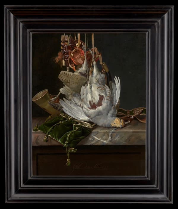 Willem Van Aelst A partridge, a hunting horn, hawking hoods and a gold-trimmed green velvet hunting bag hanging above a marble ledge Oil on canvas 22.91 x 18.15ins (58.2 x 46.1cm) Signed and dated 'Guill.mo.van.Aelst. 1673' (lower centre, on the ledge)