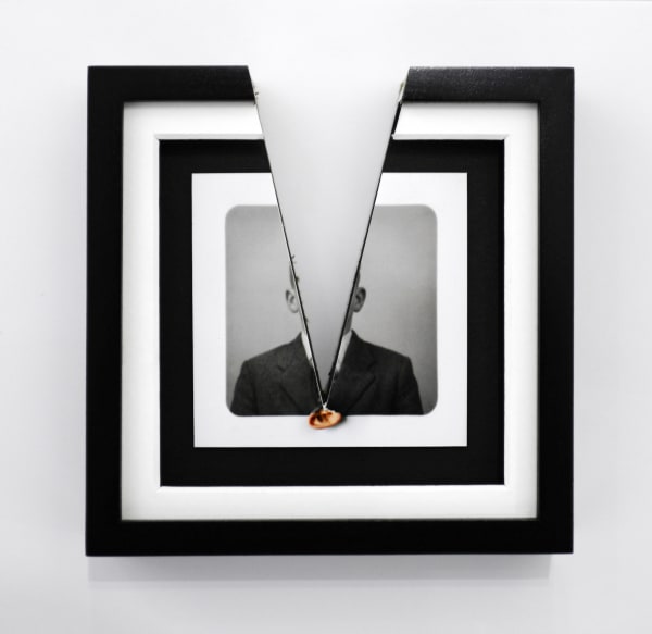 Jonny Briggs, Lapel (artist's ear bursting through print of his paternal great grandfather), 2022