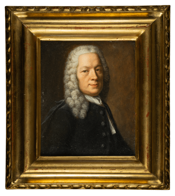 Portrait of a man with curly hair in formal attire and yearing a black coat, set against a dark background, by Robert Gardelle.