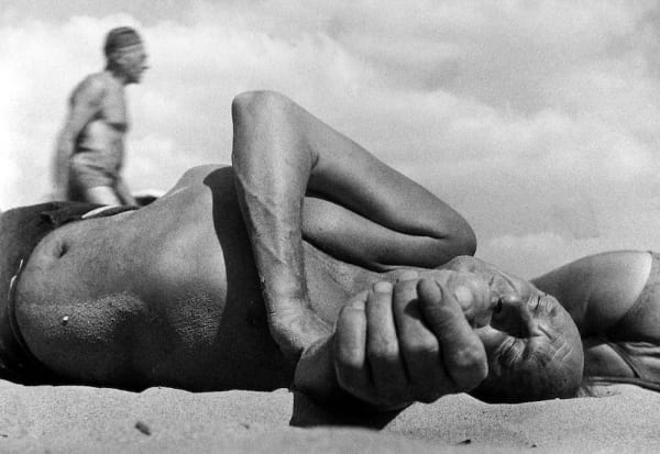 Leon Levinstein, Coney Island (old man lying in sand), c.1955