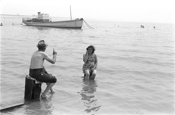 Homer Sykes, Couple ignoring the incoming tide, Southend on Sea, Essex, 1969