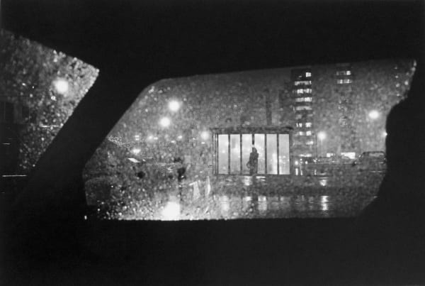 Tom Arndt, Woman at bus stop at night, Chicago, 1992