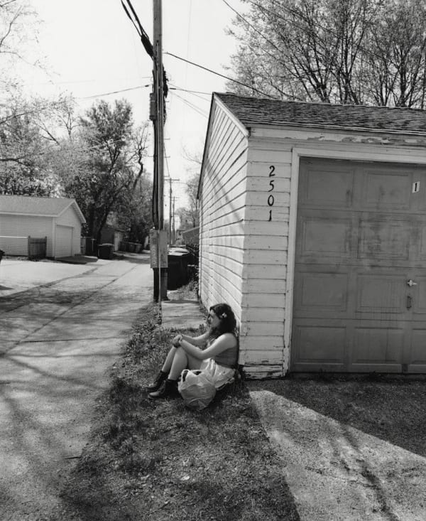 Tom Arndt, Girl sitting by a garage, 2015