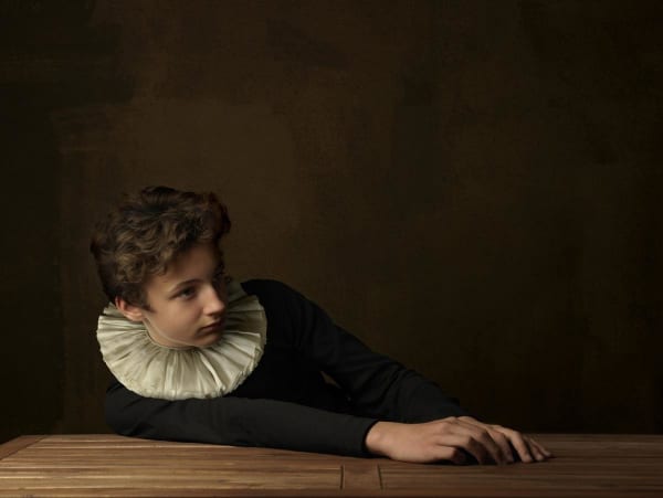 Boy with White Collar at Table