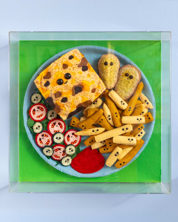 Lucy Sparrow Lasagna, Chips, Garlic Bread and Salad, 2025 Plate of food containing felt pieces curated by the artist and framed in a perspex box. From a limited edition of 20 and featuring exclusive items. 46 x 46 x 5 cm (18 1/8 x 18 1/8 x 2 in)