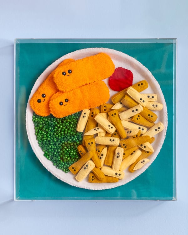 Lucy Sparrow Fish Fingers, Chips and Peas, 2025 Plate of food containing felt pieces curated by the artist and framed in a perspex box. From a limited edition of 20 and featuring exclusive items. 46 x 46 x 5 cm (18 1/8 x 18 1/8 x 2 in)