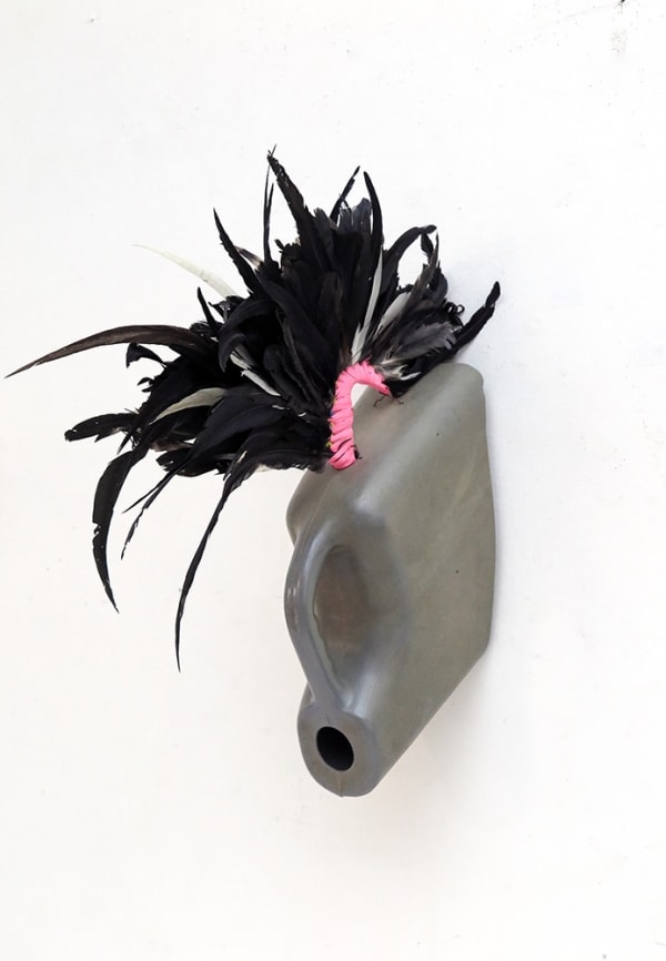 Romuald Hazoumè D.Beau Oui plastique et plumes . 58 x 32 x 24 cm 23 x 13 x 9 inches