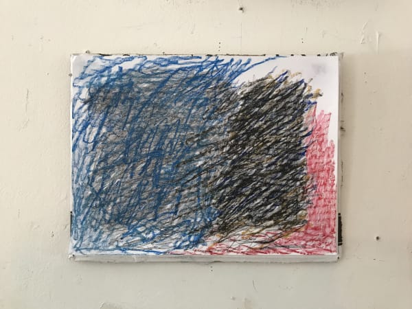 Scribble on paper in black blue and red