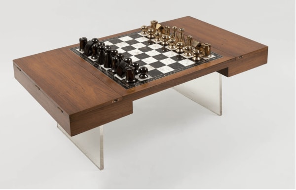 Man Ray 1890-1976Chess Set (Objet de mon affection), 1920-1962 signed and numbered 'Man Ray 45/50' (on the white King); signed, dated and inscribed 'Le Roi est à moi - La Reine est la tienne / La Tour fait un four - Le Fou est comme vous / Le Cavalier déraille - Le Pion fait l'espion. Comme toute canaille. Fait de toutes pièces / Man Ray 1962' (along the edges of the chessboard) 32 pieces: 16 in very dark bronze 16 in gilded bronze; board in rosewood and mahogany 99.5 x 57 x 9.5 cm 39 2/16 x 22 7/16 x 3 11/16 in This work is number 45 from an edition of 50 plus 5 artist's proofs, published by Marcel Zerbib, Paris (Edition record)