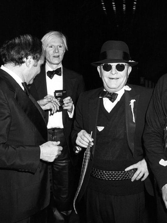 Ron Galella, Andy Warhol, Truman Capote and Lester Persky attend Steve Rubell’s birthday party at Studio 54, New York, December 2, 1978