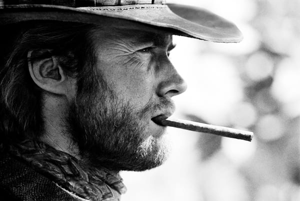 Lawrence Schiller, On set, Eastwood chews a cigar while waiting for filming to begin, Durango, Mexico, 1969