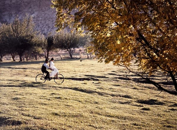 Lawrence Schiller, Paul Newman riding a bicycle with Katherine Ross sitting on the handle bars; during the production of Butch Cassidy and the Sundance Kid, Mexico,, 1968