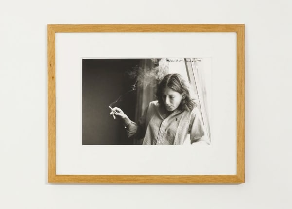 Ed Templeton Elissa smokes near window, Prague, Czech Republic, 1999, 2008 Black and white photograph with text