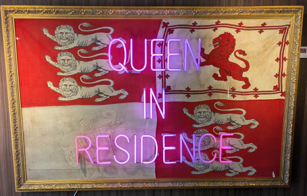 Queen in Residence neon on vintage flag
