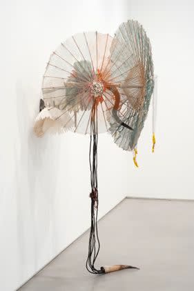 Rina Banerjee A heart of two anchors, take one bird and take one butcher, from ear to ear, it's a familiar end yet she was with a wide grin, while meat and medicine poured, even played with the poverty of country, was still an unknown friend! So she withdrew her smile , 2011 Mosquito net, fish bone, umbrella, artificial horn and pigeon, feathers 231 x 109 x 96.5 cm