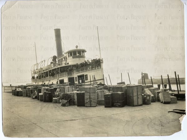 "Arriving on Machigonne " Faces full of hope peer down at Ellis Island from the ferry deck., c.1920s