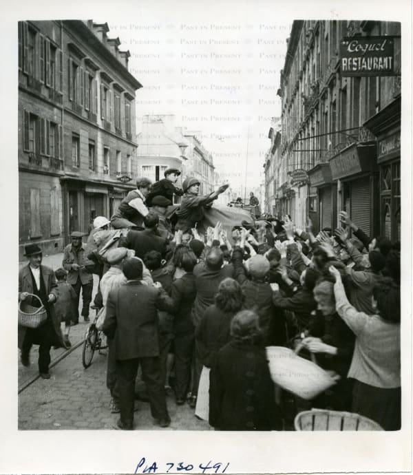 British Official Photo, “For the Sweet Tooth: Liberation and Longing on a French Street”, Caen 1944, 1944