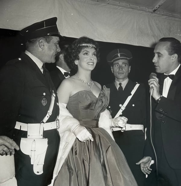 Claude Schwartz, Gina Lollobrigida arrives at the Palais des Festivals during the Cannes Festival, 1958