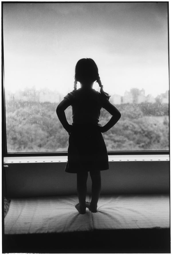 Elliott Erwitt, New York City. 1982. 'Little girl looking out window', 1982