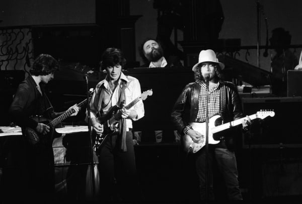 Ken Regan, The Last Waltz, Rick Danko, Robbie Robertson and Bob Dylan, at The Winterland Ballroom in San Francisco on Thanksgiving Day, 1976
