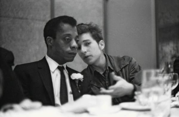 Ted Russell, Bob Dylan and James Baldwin talking at the Emergency Civil Liberties Committee's Bill of Rights Dinner, NYC, 1963
