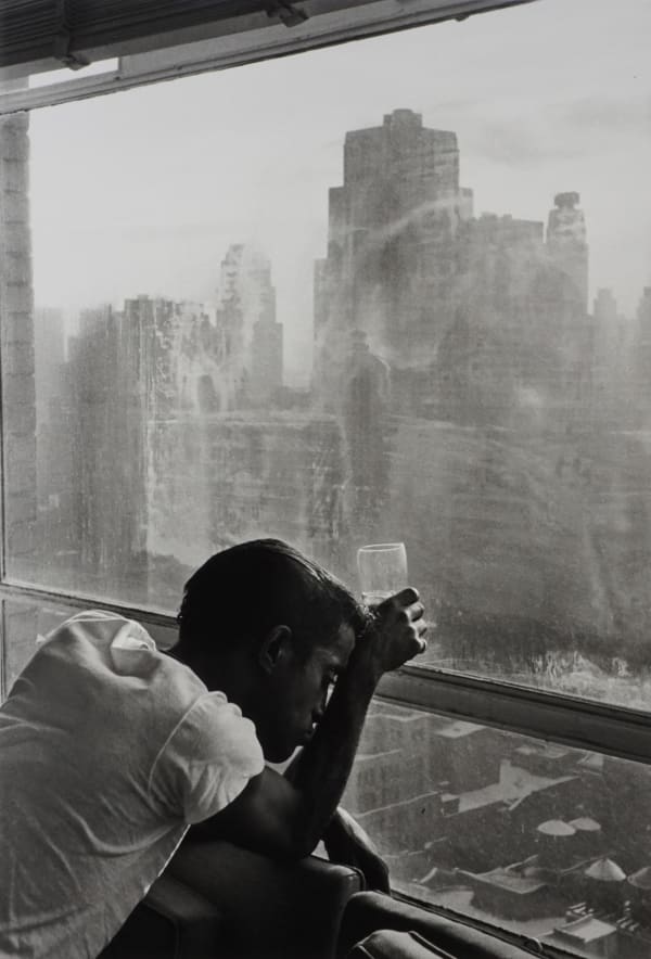 Burt Glinn, Sammy Davis Jr. looks out of a Manhattan window. New York, 1959