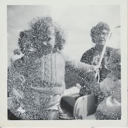 John Latour, Young girl with curls holds the carriage of her little sibling. Two older women look on. A third woman has her back turned to the scene , 2020