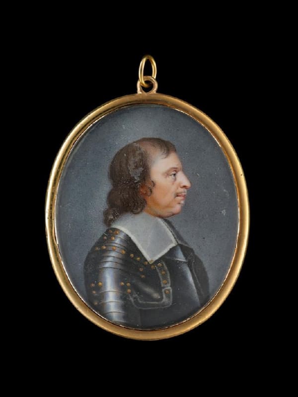 English School, Portrait enamel of Oliver Cromwell (1599-1658), profile to the right, wearing gilt-studded armour and falling lawn collar