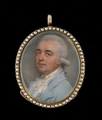 John Smart, A portrait miniature of a Gentleman wearing a pale blue coat, white waistcoat, frilled chemise and stock, his powdered wig worn en queue and tied with a black ribbon bow, 1786