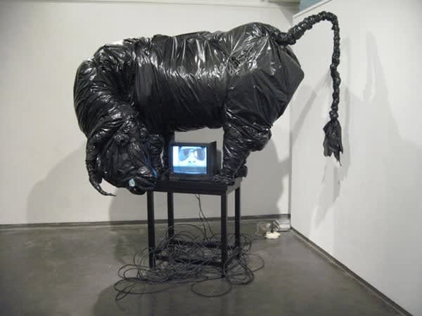 Siddhartha Kararwal Funny Garbage, 2009 Garbage bags, scarp, scrap television, foam and wooden stand 72 x 60 x 48 inches