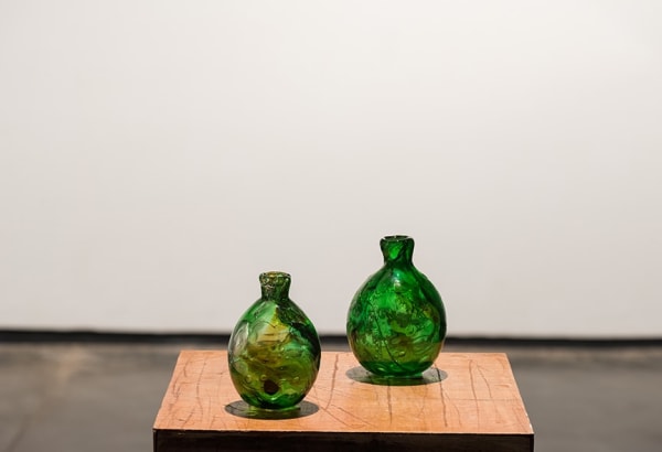 David Horvitz Untitled (Dead Hourse bay, Palos Verdes, Malibu, San Pedro, Stromboli, Girgaum Chowpatty, Mumbai), 2016 Two Glass vases hand blown from different pieces of sea glass found on various beaches by the artist, melted back together. Courtesy of the artist and Chert-Berlin.