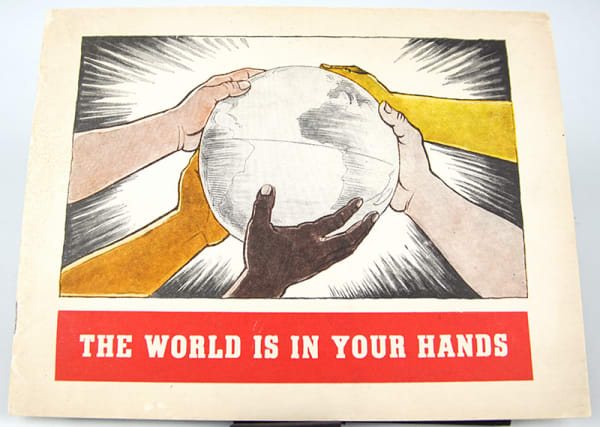 The World Is in Your Hands by Herluf Bildstrup. Front cover with hands holding the world.