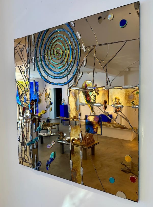 Eccentric British sculptor Andrew Logan's presents a fractured mirror design combined with gold and blue decorations.