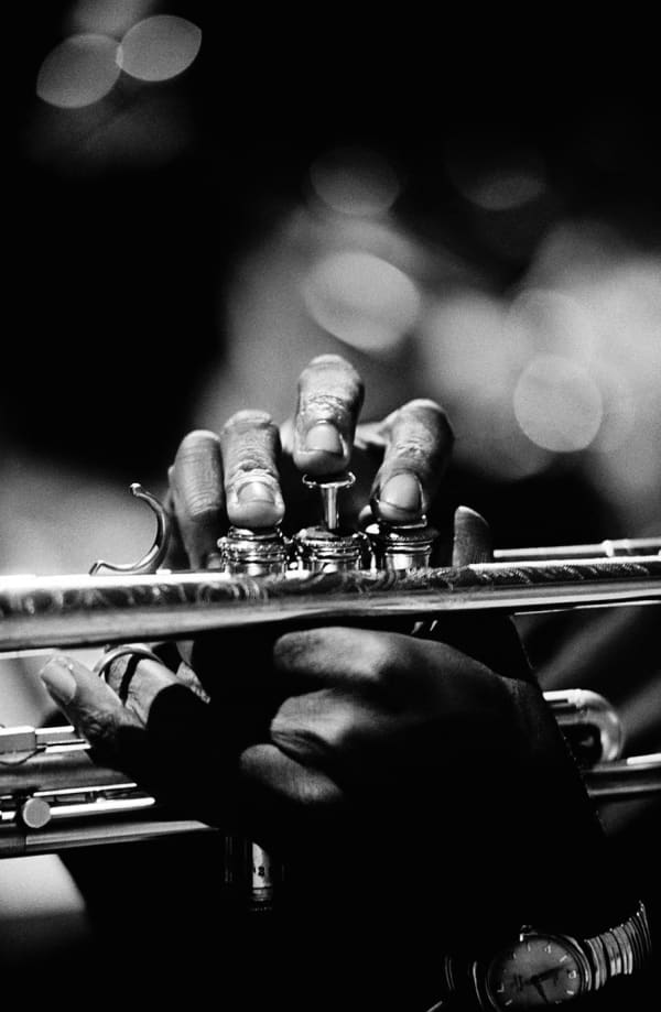 Photograph by Jim Marshall of Miles Davis' hands playing his instrument, available at the Rebecca Hossack Art Gallery.