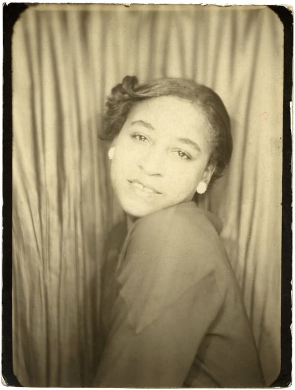 ENLARGEMENT REPRINT Vernacular, Untitled (Photobooth - young woman posing looking over her shoulder)