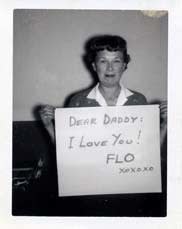 ENLARGEMENT REPRINT Vernacular, Untitled (Dealer title: "Flo Loves Daddy" - Woman holding a sign "Dear Daddy: I Love you! Flo xoxoxo")