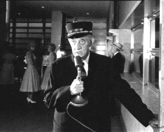O. Winston Link, NW1119, Buck Stewart calls the trains, Roanoke station, Roanoke, VA, 1956