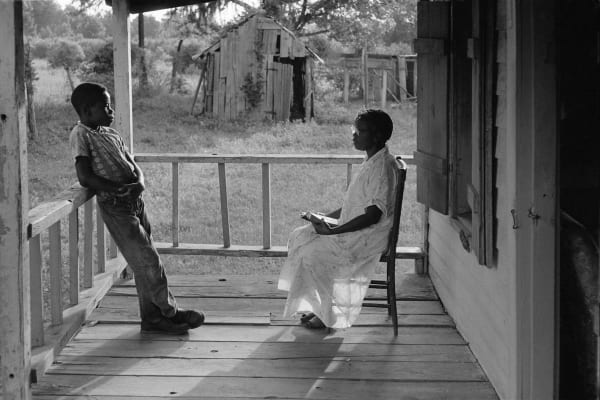 Constantine Manos, Island Boy, South Carolina, (Reading Bible on porch), 1952