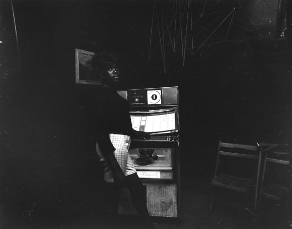 Bruce Davidson, East 100th Street (young woman standing at jukebox in social club), 1966-1968