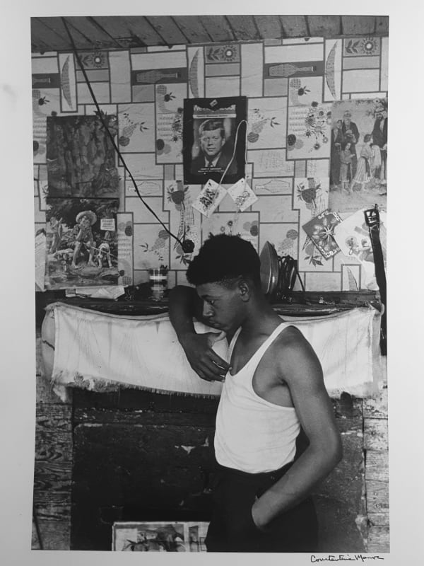 Constantine Manos, Untitled, Sharecroppers, South Carolina (man in white tee shirt near fireplace, JFK), 1965