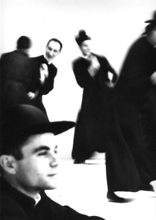 Mario Giacomelli, Pretini (vertical, priest in foregrnd in profile), 1968