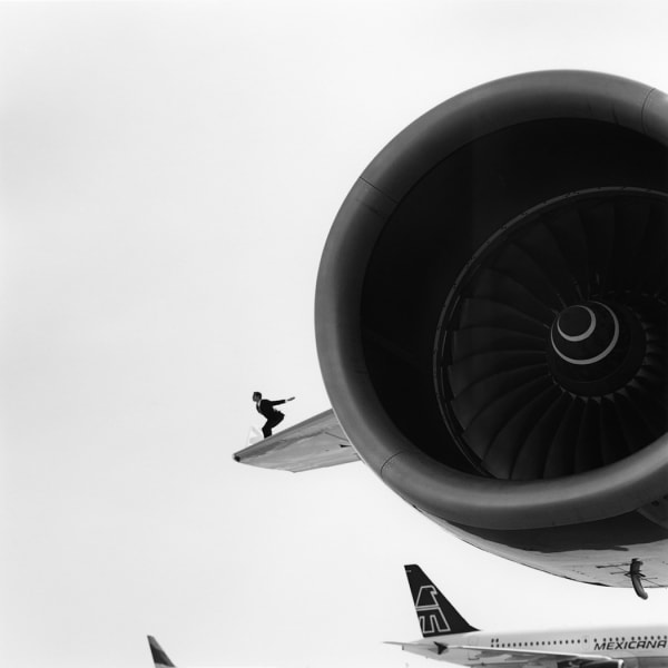 Rodney Smith, Reed perched on airplane wing, JFK, New York, 2007